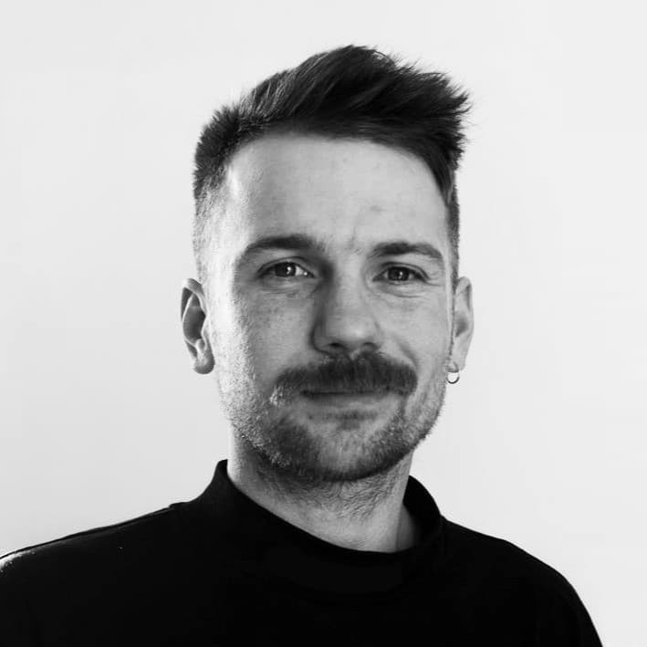 Ollie Micek, Founder of SampleSync, looking thoughtful.